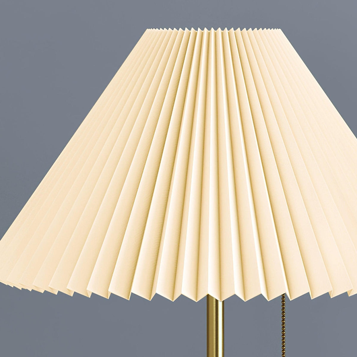 Mathella Table Lamp close-up of the white pleated shade, brass stem and pull chain