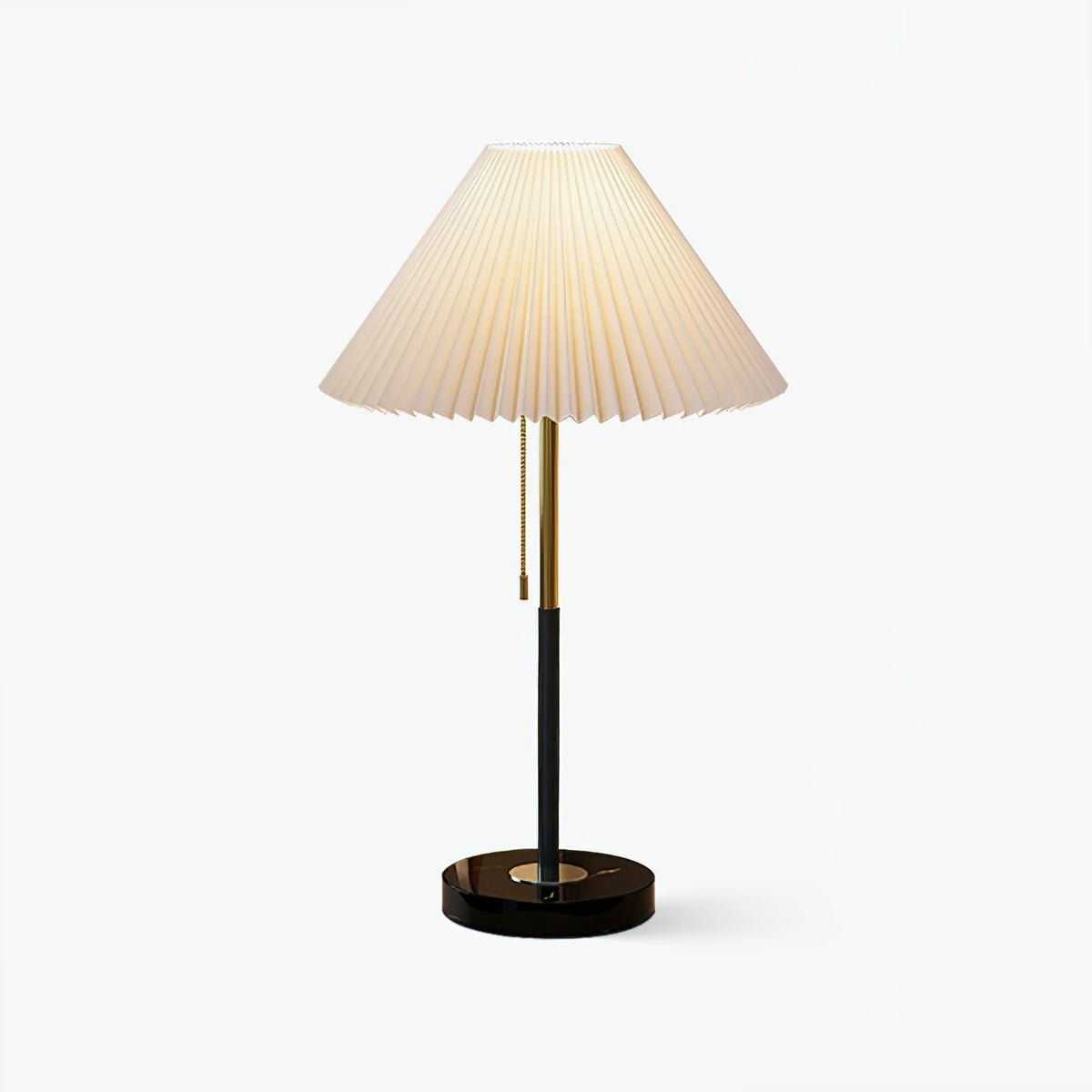 Mathella Table Lamp in white with pleated shade, brass-and-black stem and round black base on a white background