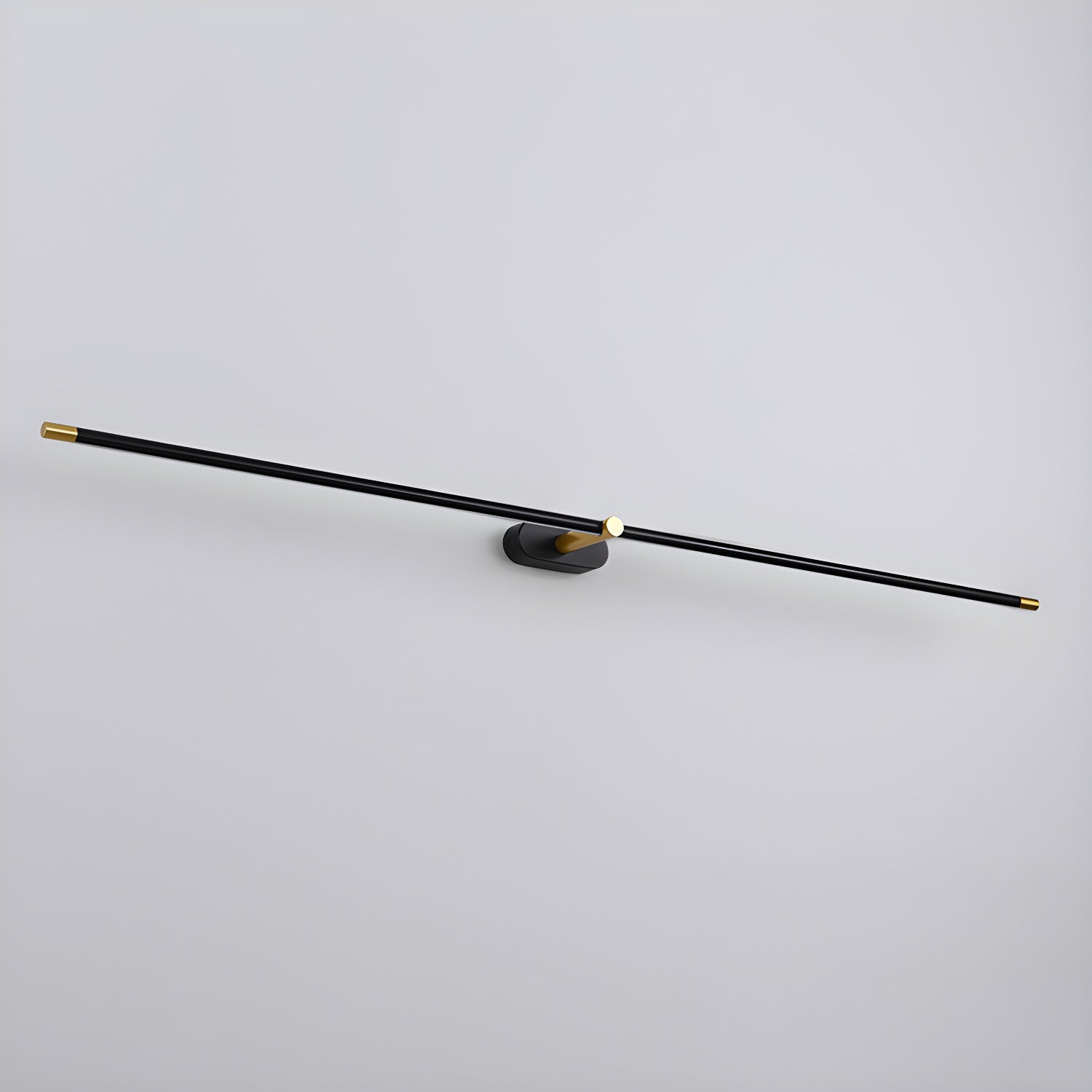 Black and gold slim linear LED wall light on an oval wall plate, three-quarter view showing the full bar length on a plain grey background