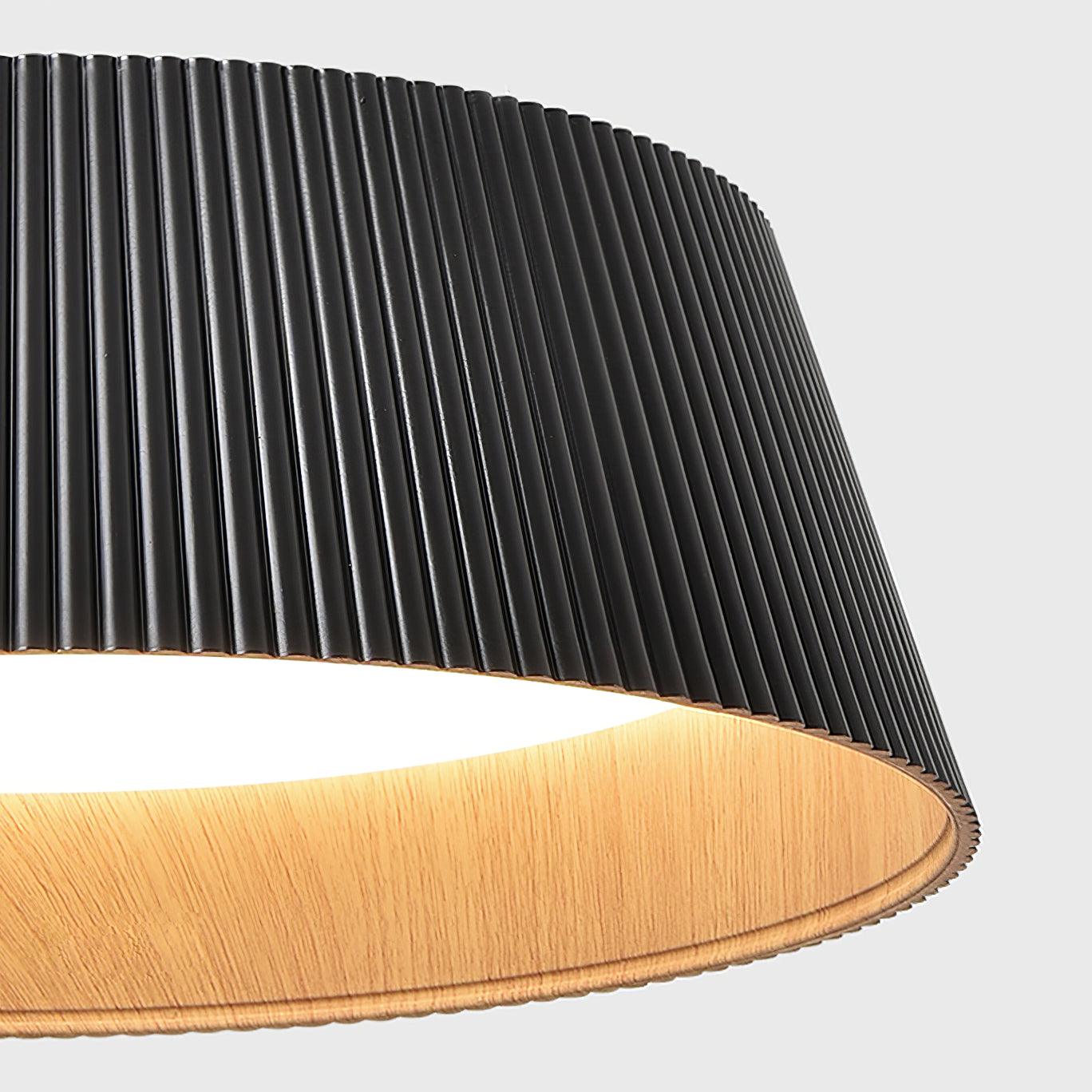 Close view of the ribbed black outer and the wood-look inner rim.
