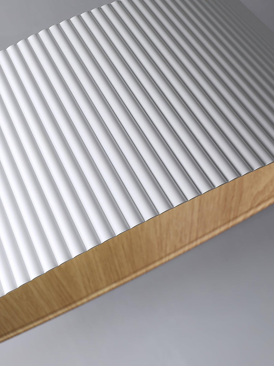 Close view of the ribbed white outer surface and the wood-look rim.