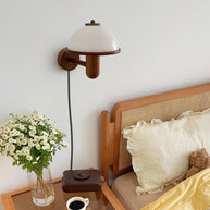 Mushroom Wood Wall Lamp installed beside a bed