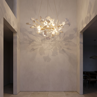Gilded Ginkgo Leaf Chandelier in an entryway landing at dusk