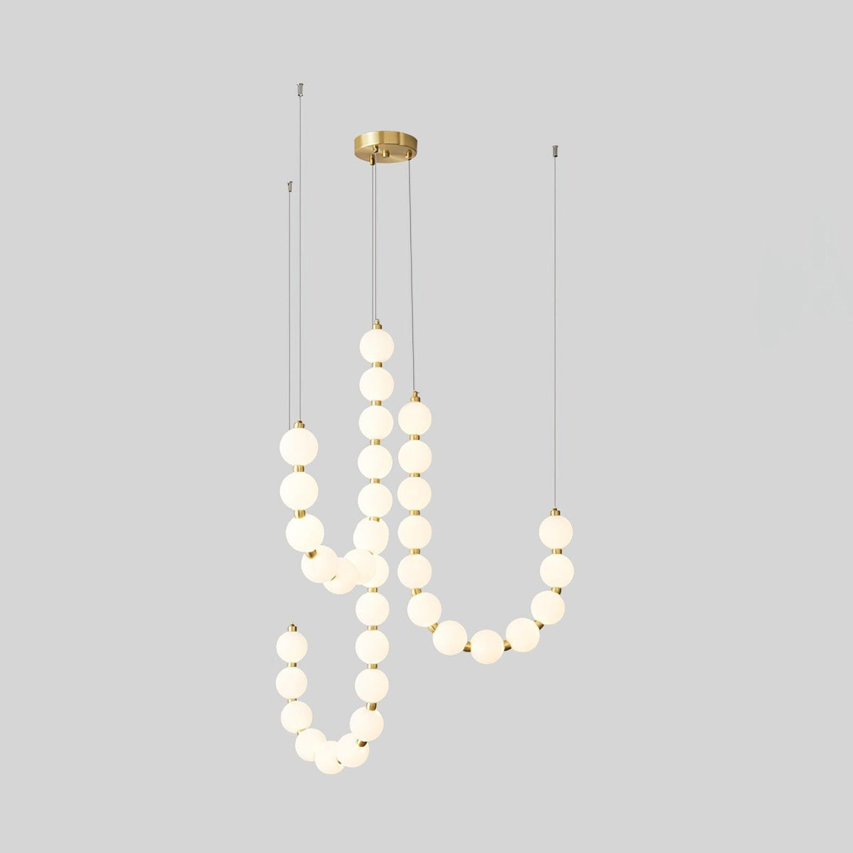 Perloria Chandelier, five looping strands of lit opal globes with round brass canopy