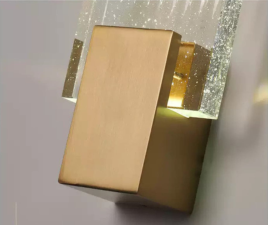 Close view of the brass mount and the bubbled glass, lit.