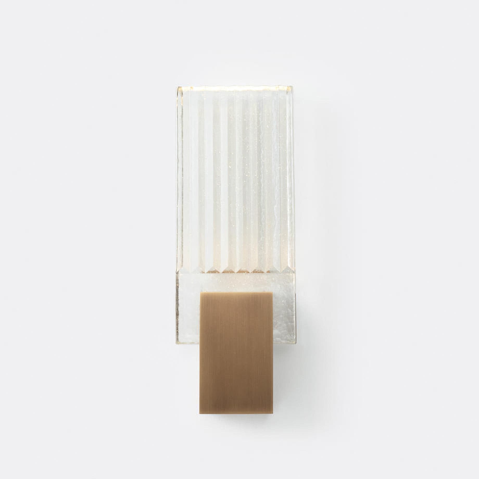 Wall light with a ribbed clear glass panel and a gold-toned metal mount, shown unlit on a white background, seen straight on.