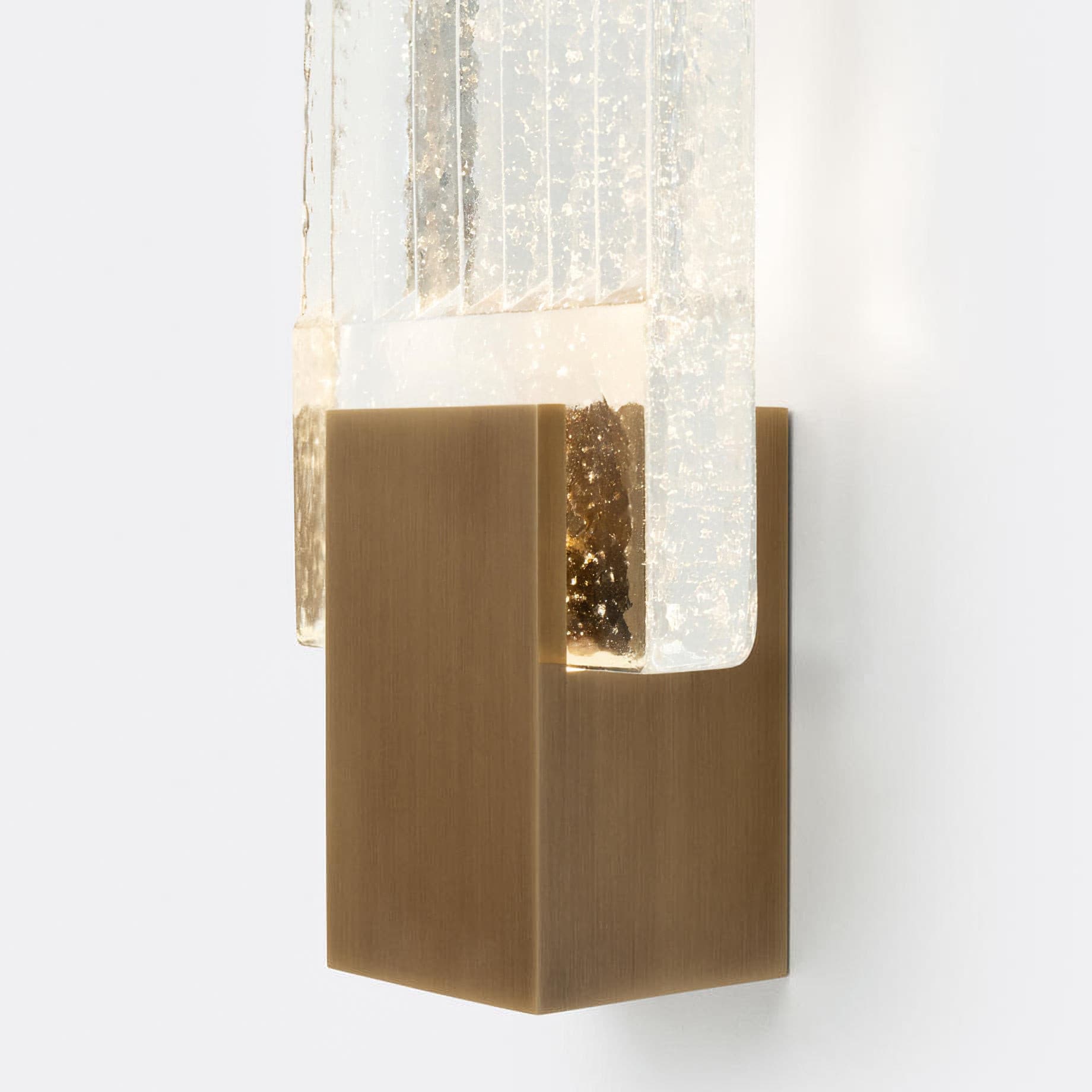 Close view of the brass mount holding the ribbed glass panel.