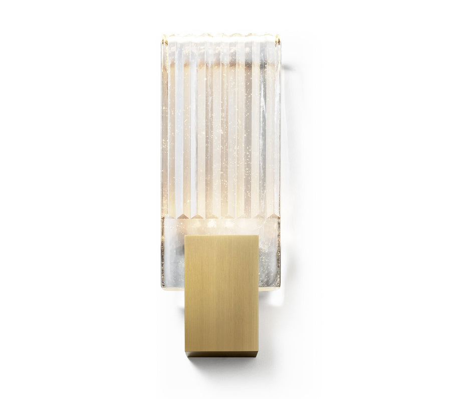 Wall light with a ribbed clear glass panel and a gold-toned metal mount, shown unlit on a plain background.