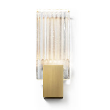 Wall light with a ribbed clear glass panel and a gold-toned metal mount, shown unlit on a plain background.