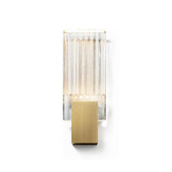 Wall light with a ribbed clear glass panel and a brushed brass mount, shown small and unlit on a white background.
