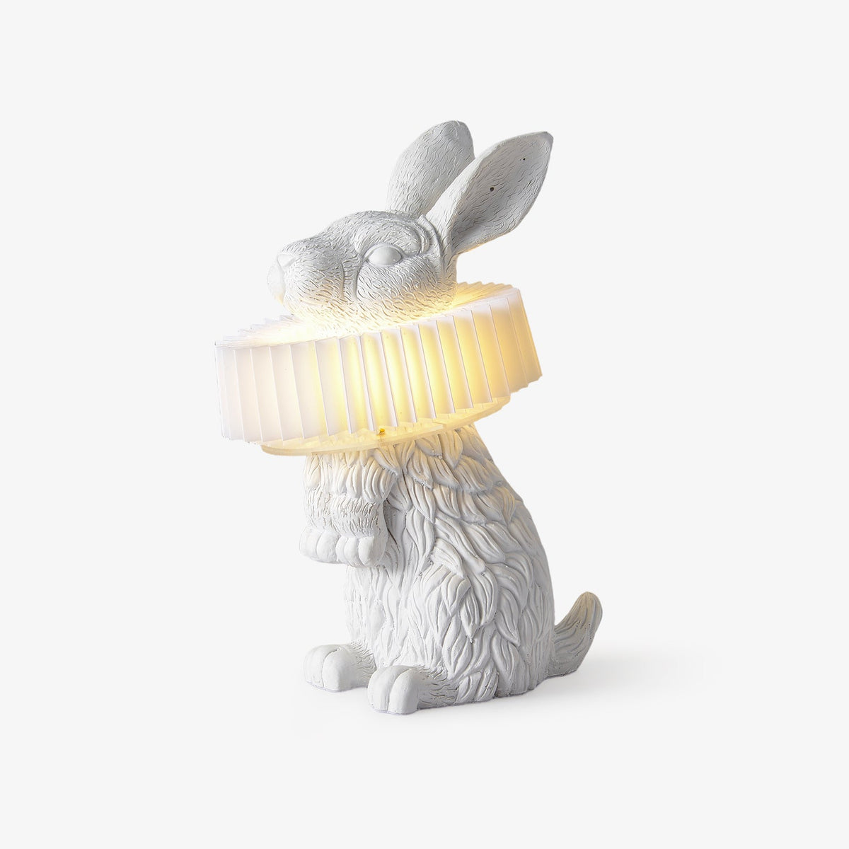 Rabellin Table Lamp - standing white leaf-textured rabbit with pleated ruff shade glowing warm, white background