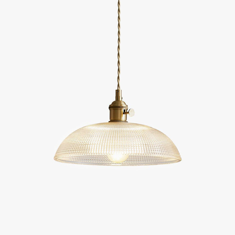 Pendant light with a ribbed glass dome shade and a gold-toned lamp holder, lit, shown on a white background.