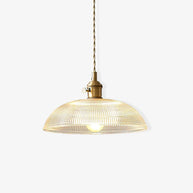 Pendant light with a ribbed glass dome shade and a gold-toned lamp holder, lit, shown small on a white background.