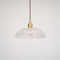 Pendant light with a ribbed glass dome shade and a gold-toned lamp holder, unlit, shown on a plain grey background.