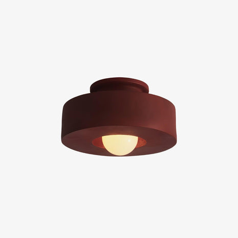 Simon Ceiling Lamp, front view of the red fixture on a plain white background