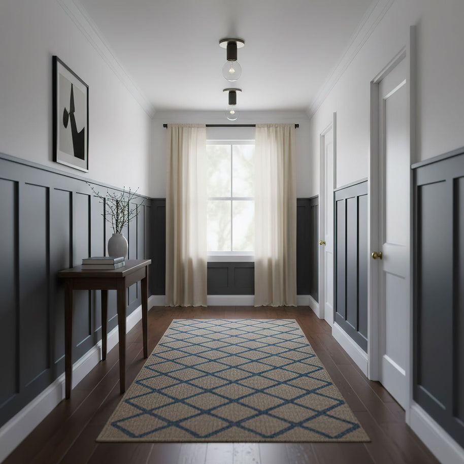 Two of the ceiling lights fitted along a hallway with dark blue panelled walls.