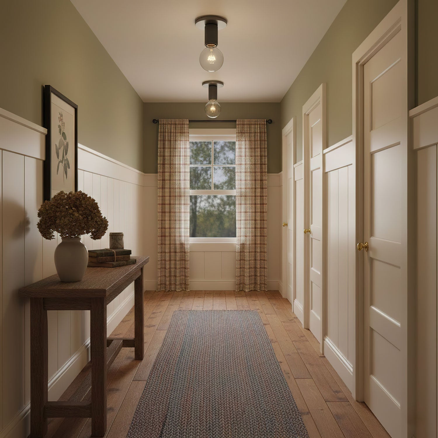 Two of the ceiling lights fitted along a hallway with olive walls.