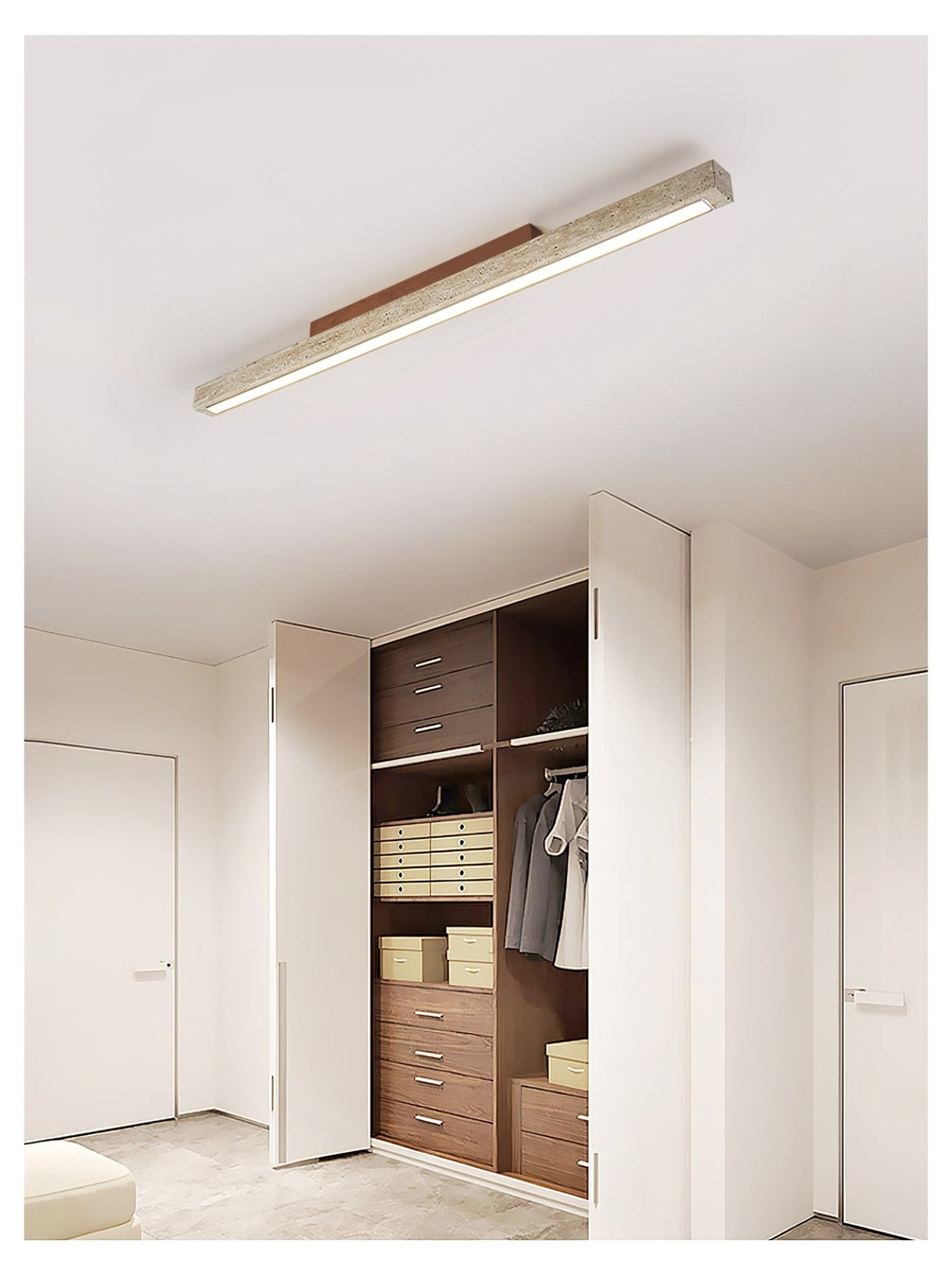 Travellin Ceiling Light, travertine bar with dark walnut mount above a wardrobe