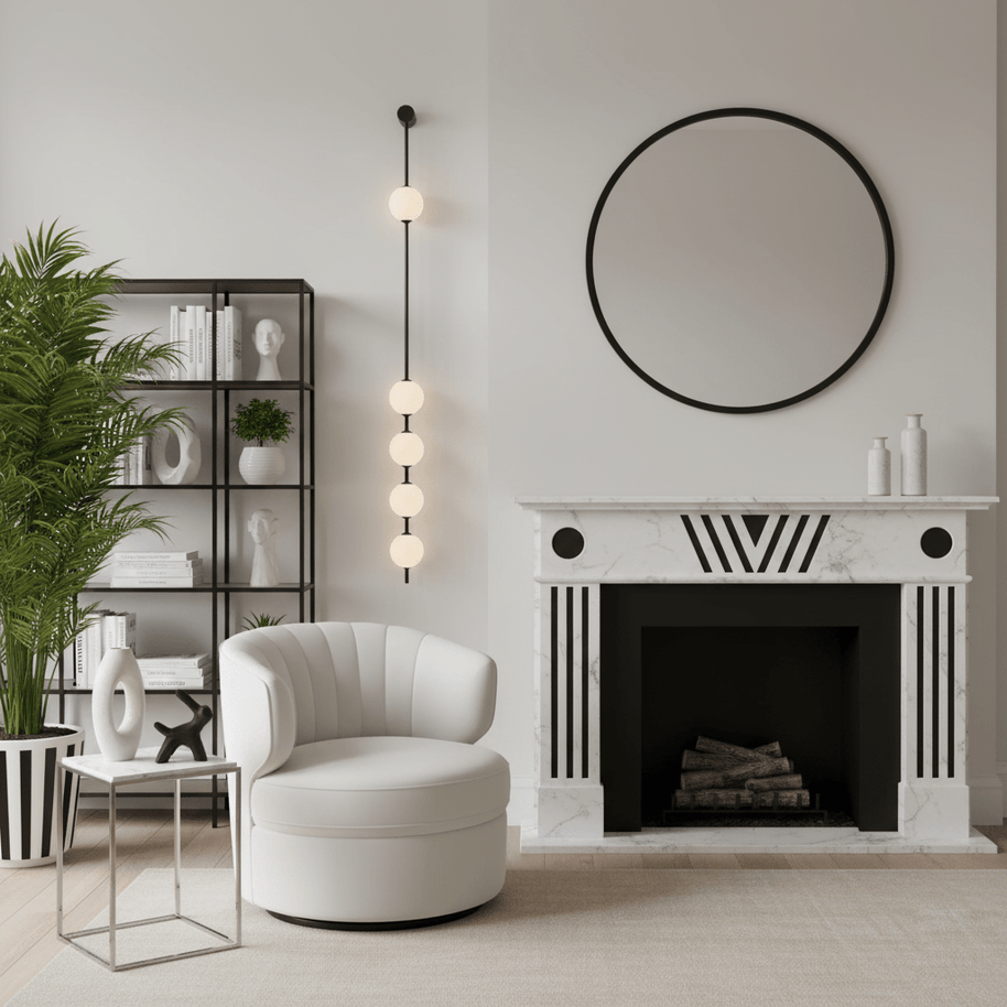 Wall lamp with a vertical row of white ball shades on a slim black rod lit beside a fireplace and a round mirror.