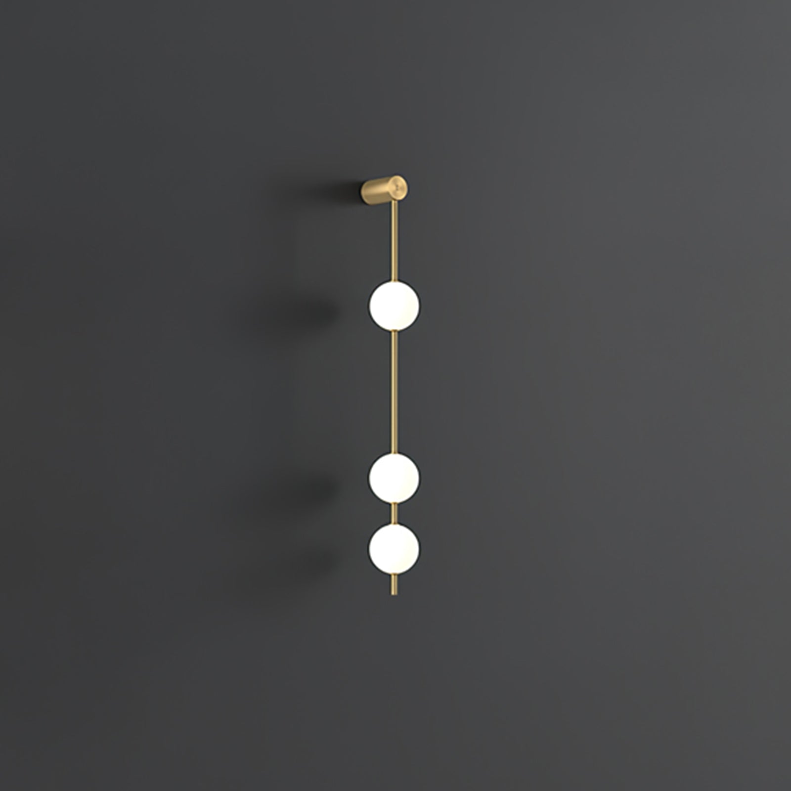 Wall lamp with a vertical row of white ball shades on a slim brass-coloured rod, unlit, on a grey wall, with a short row of shades.