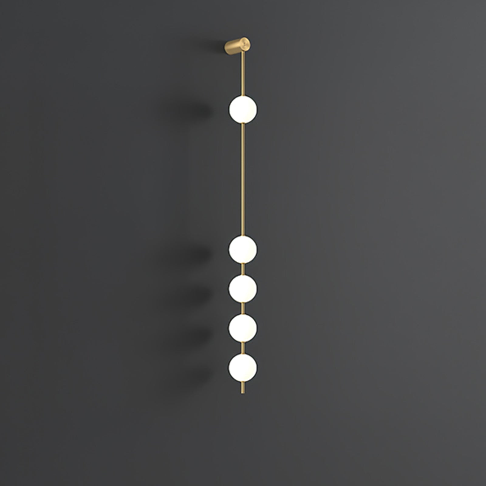 Wall lamp with a vertical row of white ball shades on a slim brass-coloured rod, unlit, on a grey wall.