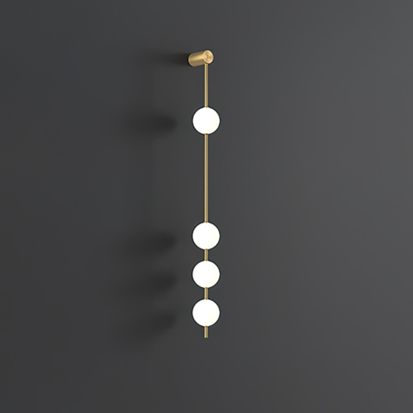 Wall lamp with a vertical row of white ball shades on a slim brass-coloured rod, unlit, on a grey wall.