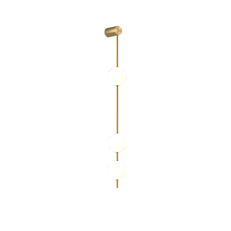 Wall lamp with a vertical row of white ball shades on a slim brass-coloured rod, unlit, on a white background.