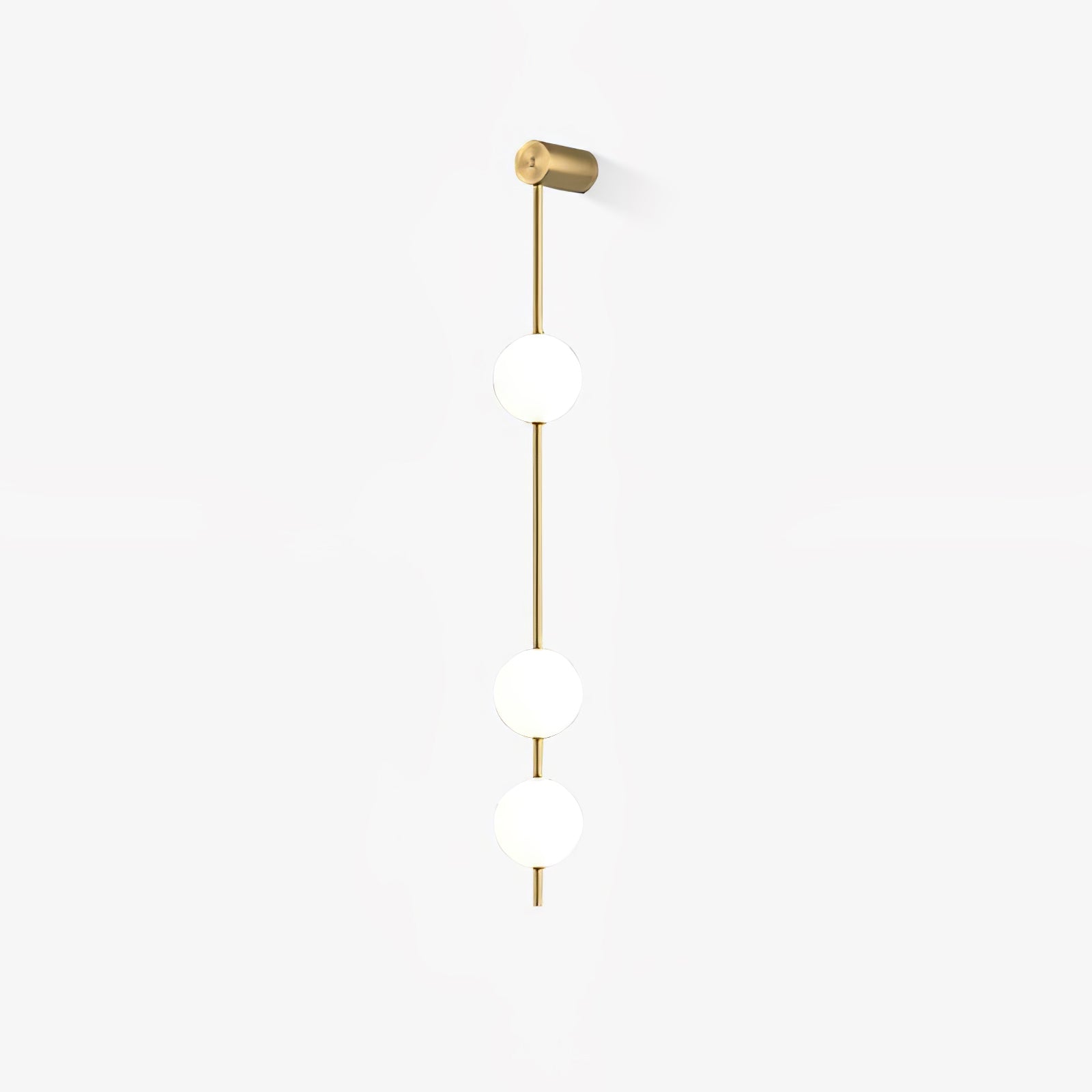 Wall lamp with a vertical row of white ball shades on a slim gold-toned rod, unlit, on a white background with a soft shadow.