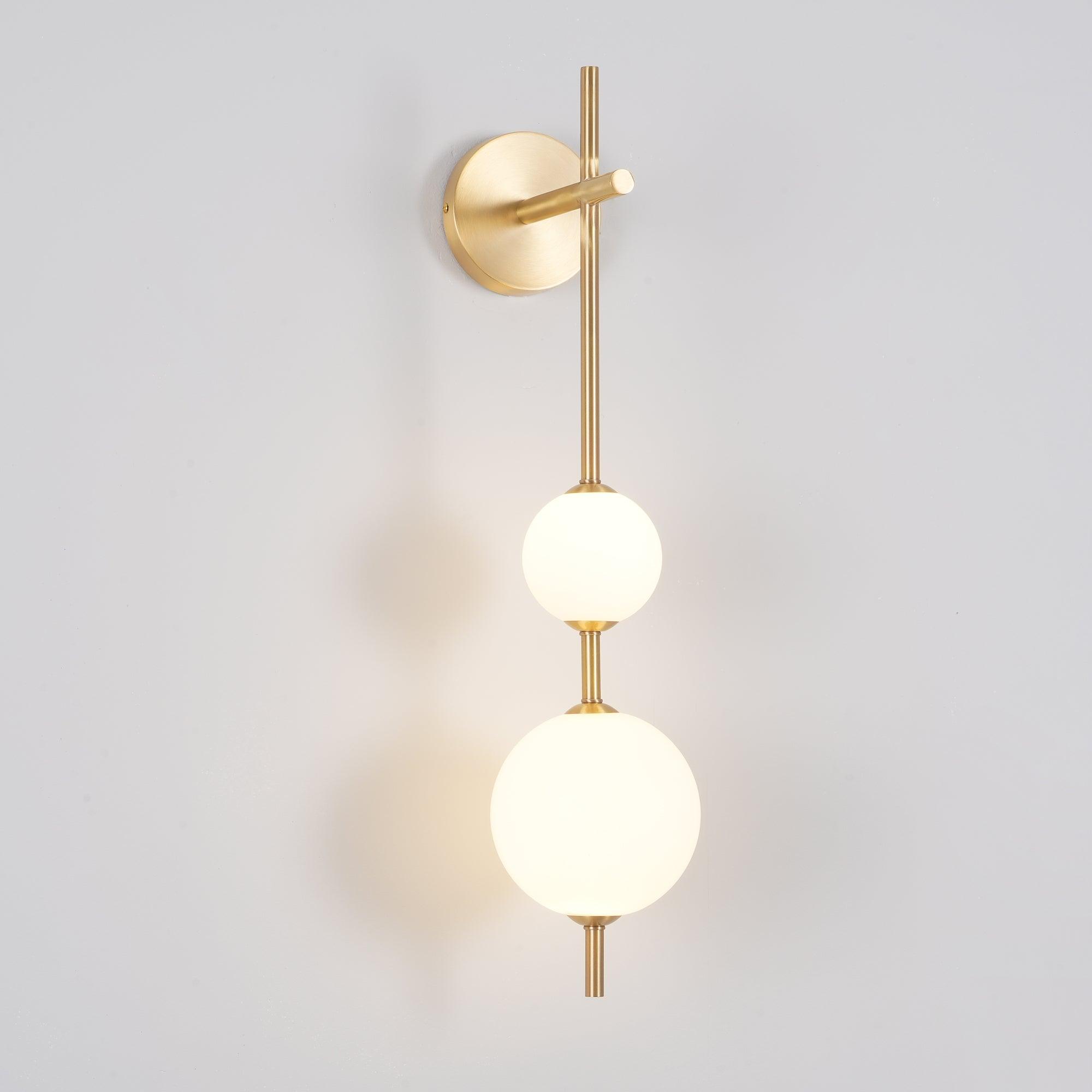 Solenne Vertical Globe Wall Light in Brass, 5.9 in dia x H 25.6 in - Comvilo lighting