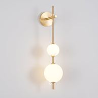 Solenne Vertical Globe Wall Light in Brass, 5.9 in dia x H 25.6 in - Comvilo lighting