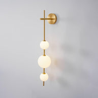 Solenne Vertical Globe Wall Light in Brass, 5.9 in dia x H 33.5 in - Comvilo lighting