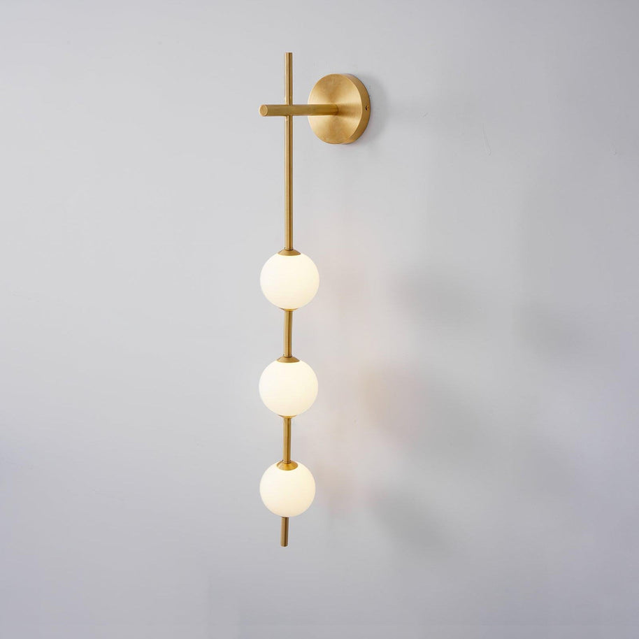 Solenne Vertical Globe Wall Light in Brass, 3.9 in dia x H 30.7 in - Comvilo lighting