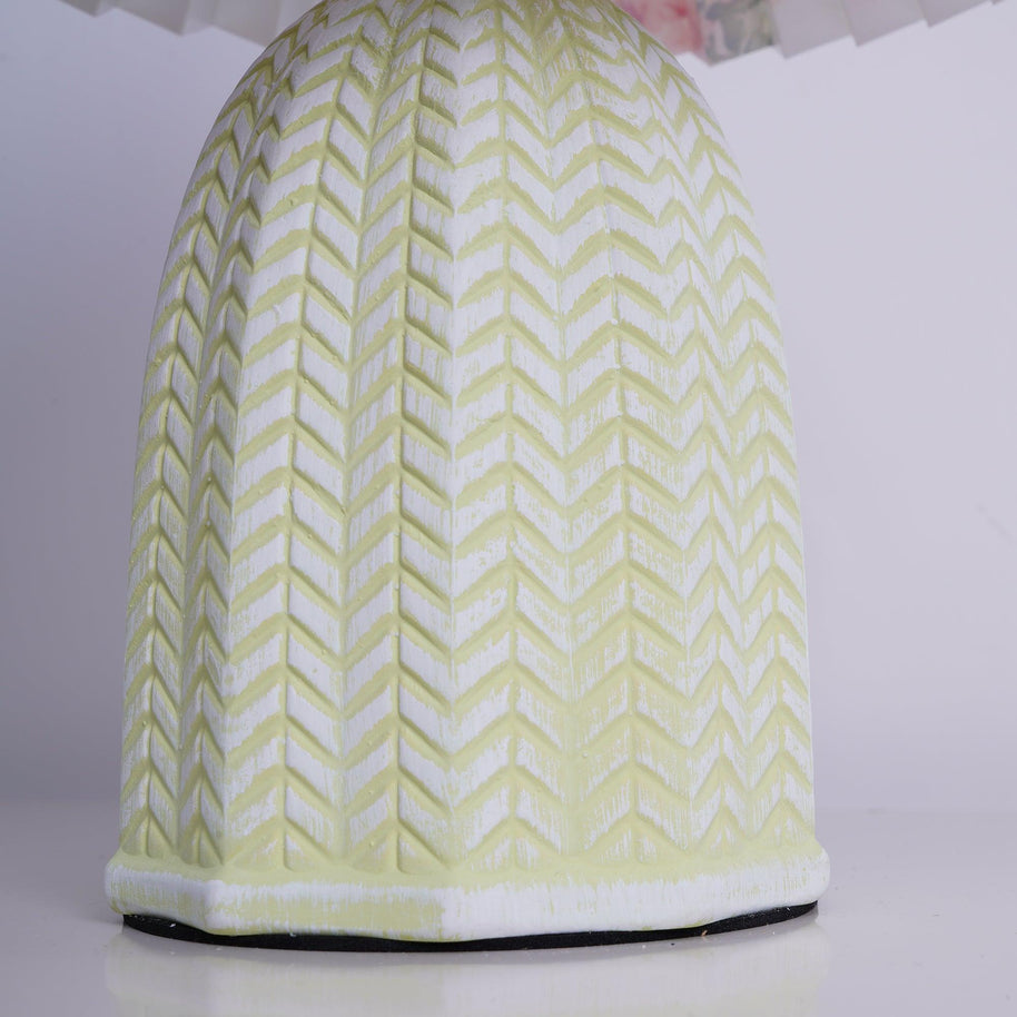 Close view of the pale green base showing its raised chevron pattern.