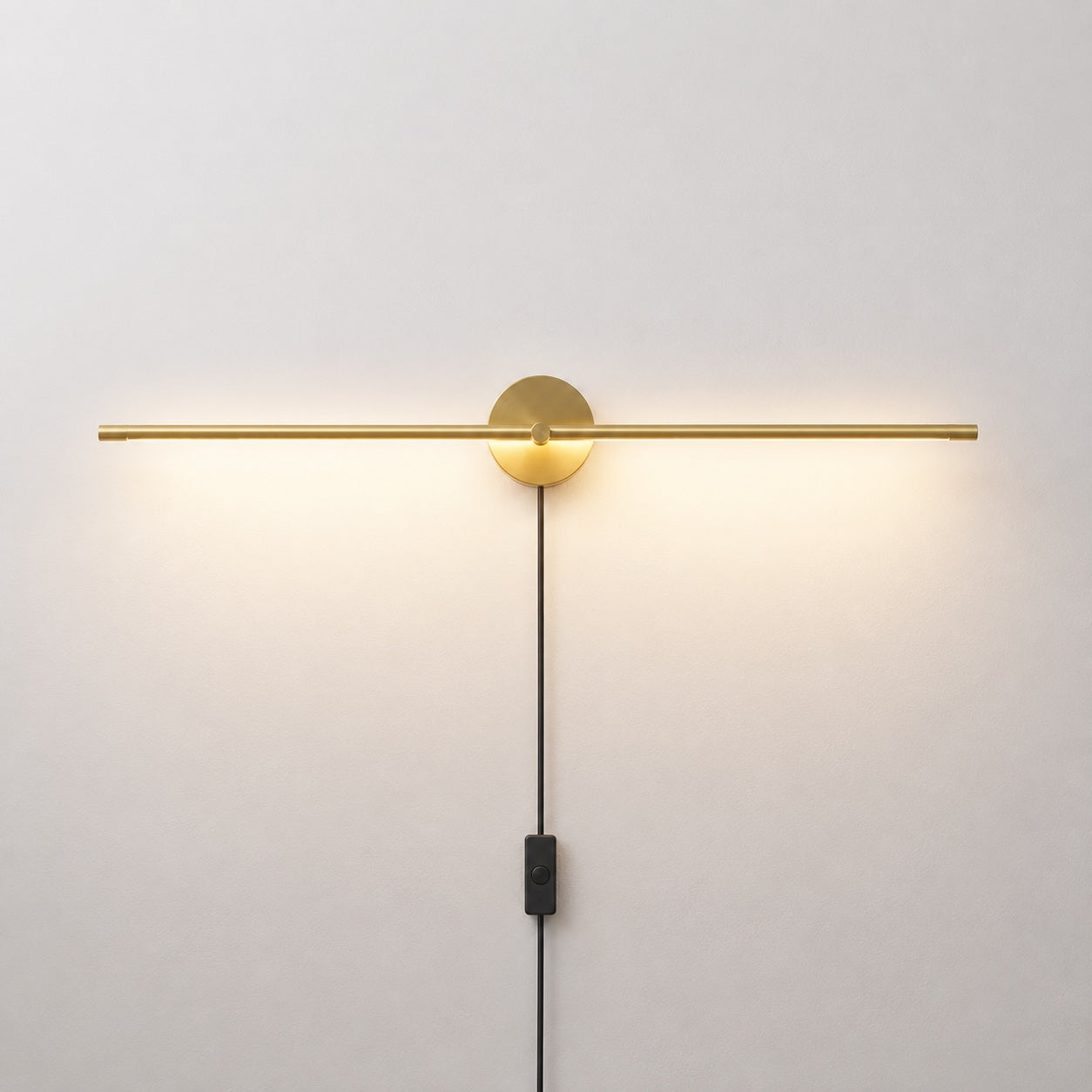Elaris Linear Wall Light - lit studio image on white background for Comvilo lighting