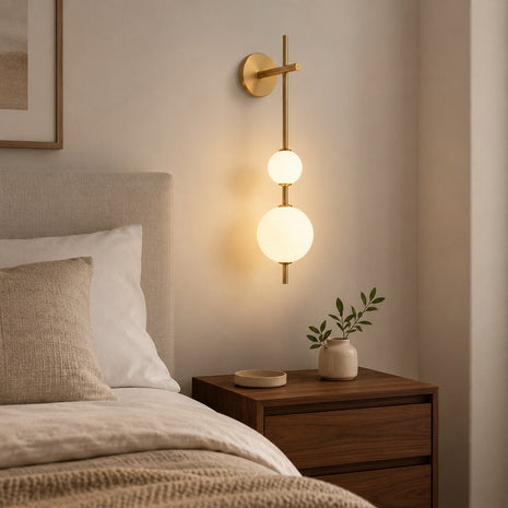 Solenne Vertical Globe Wall Light - bedside lifestyle room image for Comvilo lighting