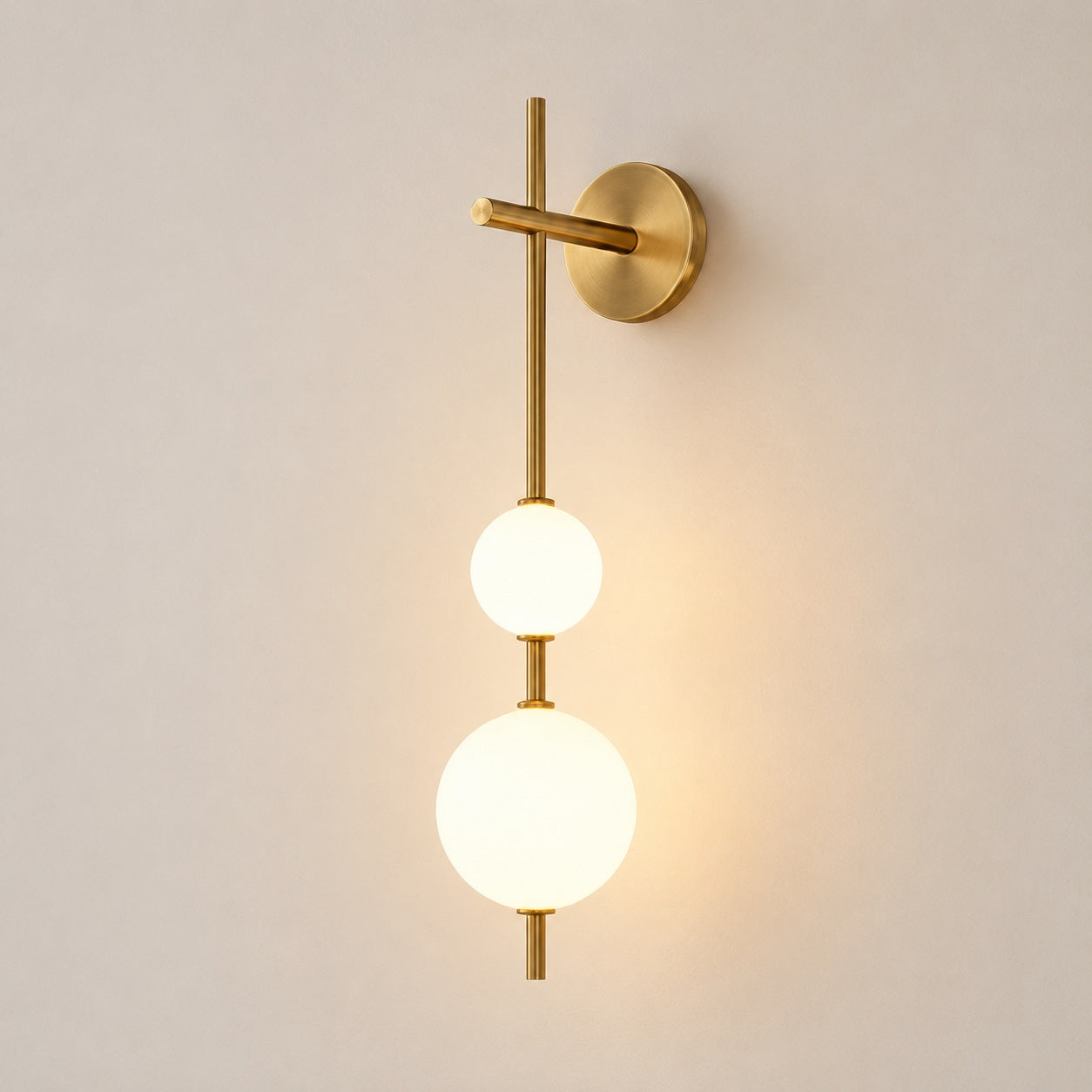 Solenne Vertical Globe Wall Light - lit studio image on white background for Comvilo lighting