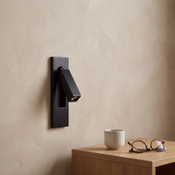 Valen Recessed Bedside Wall Sconce shown at scale beside a bedside table