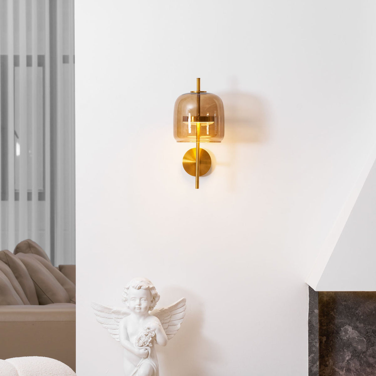 Clepsa Hourglass Wall Sconce, Gold & Coffee lit above cherub and sofa