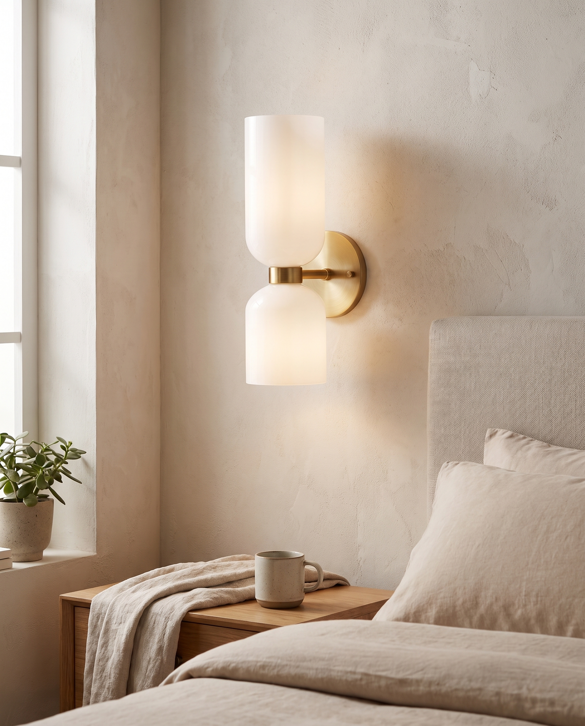 Dovren Double Cylinder Wall Light in a bedroom in soft daylight