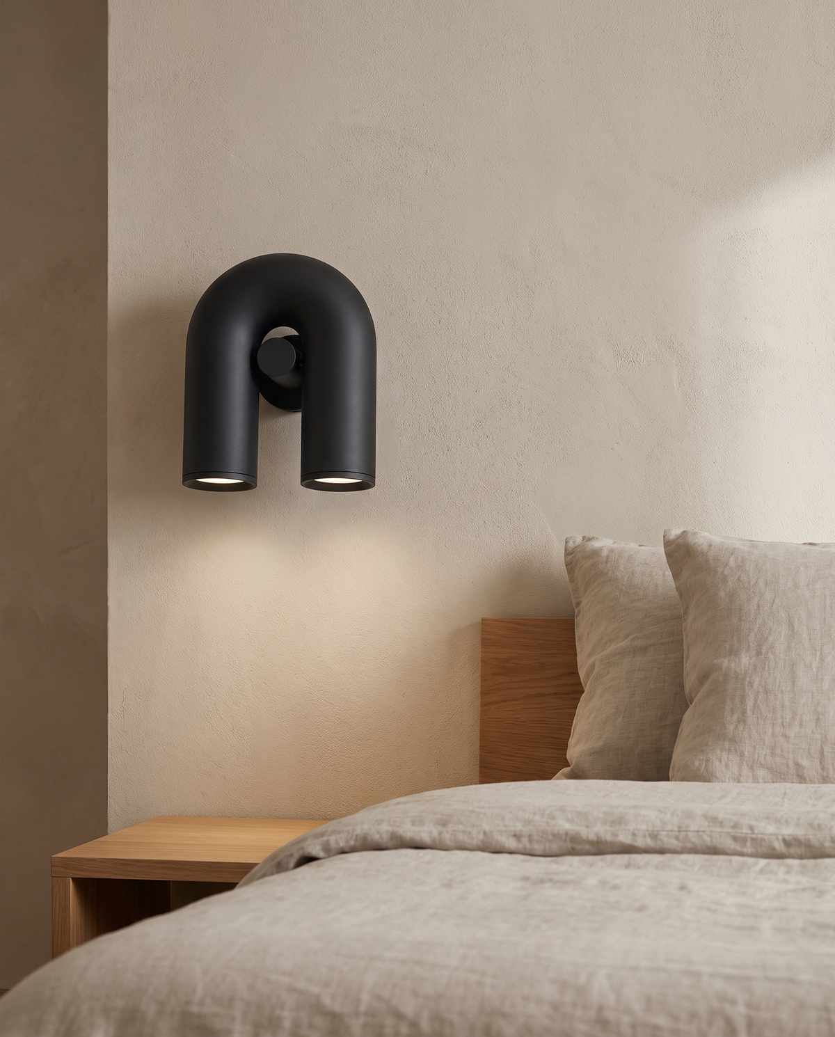 Ulvra Arch Wall Light in a bedroom in soft daylight