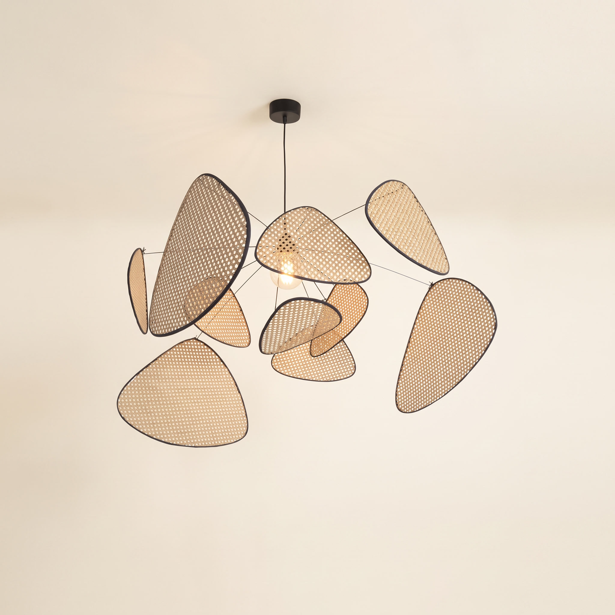 Weavra Rattan Screen Pendant Light with ten black-edged rattan cane panels floating around a central bulb