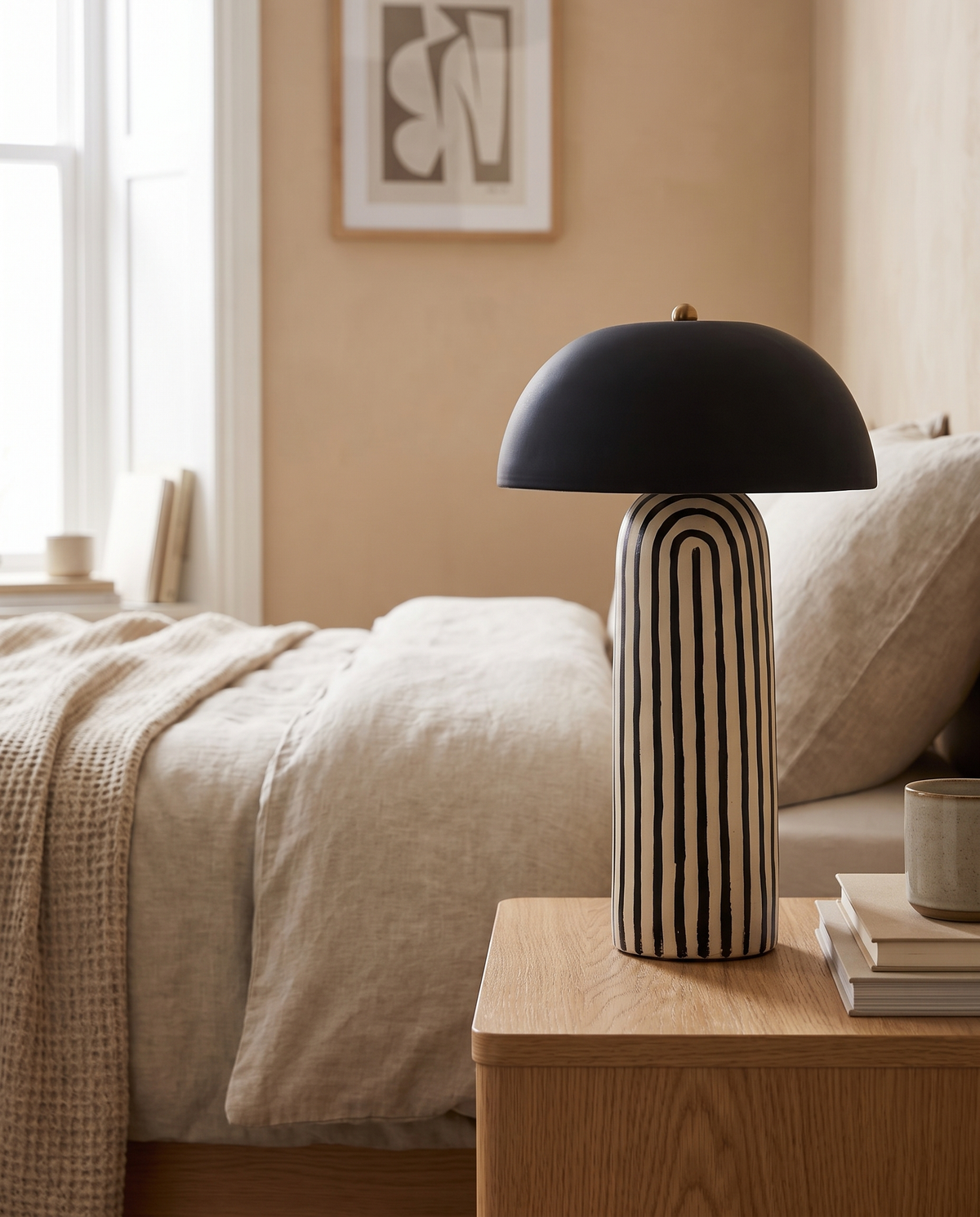 Linvera Striped Ceramic Table Lamp in a bedroom in soft daylight