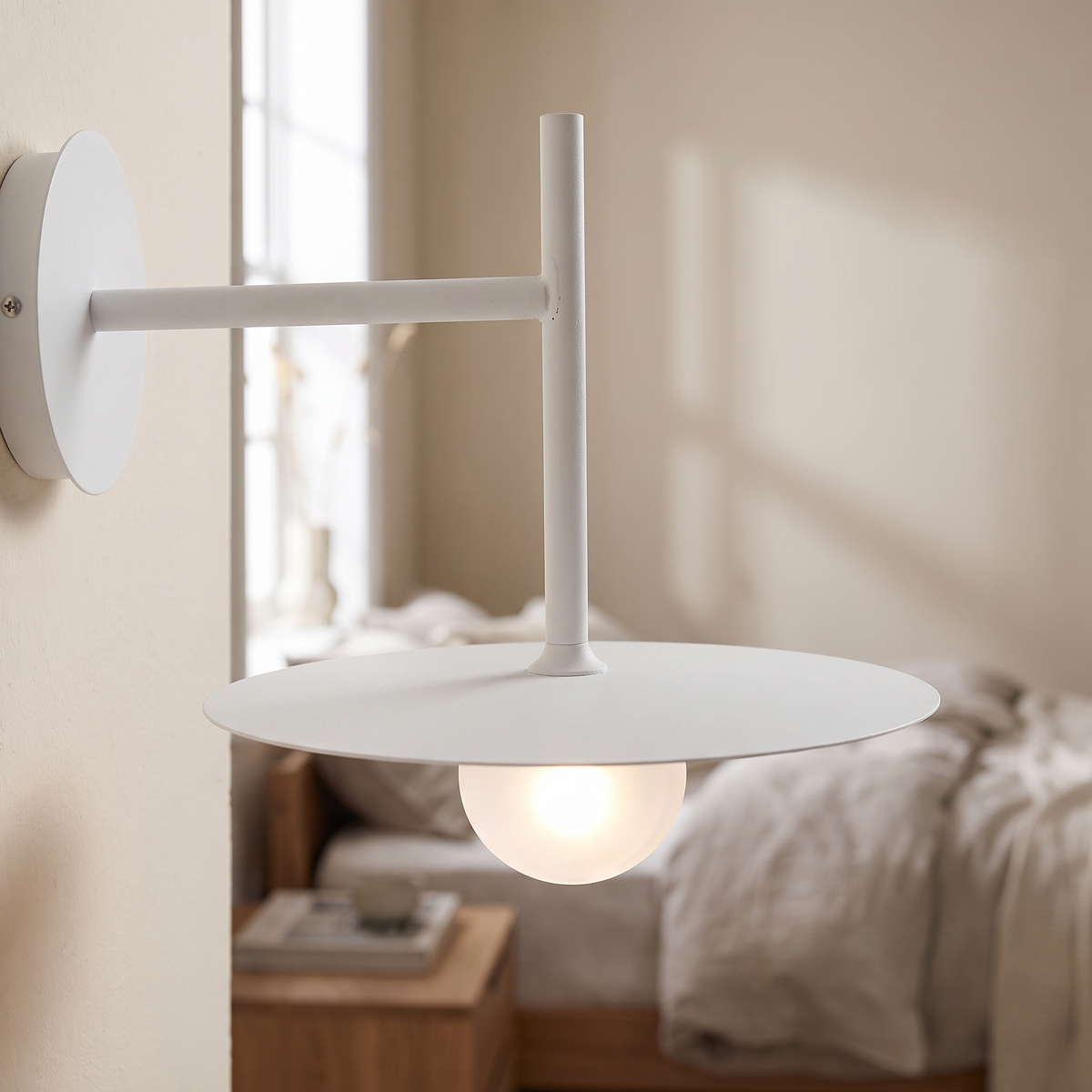 Dalvren Saucer Wall Light, closer view in a bedroom