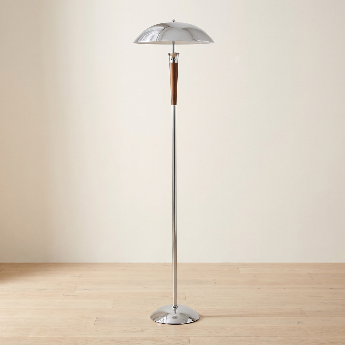Domarin Chrome and Walnut Floor Lamp: floor lamp with a polished chrome mushroom dome shade, a slim chrome stem with a tapered walnut wood section just below the shade, and a round domed chrome base