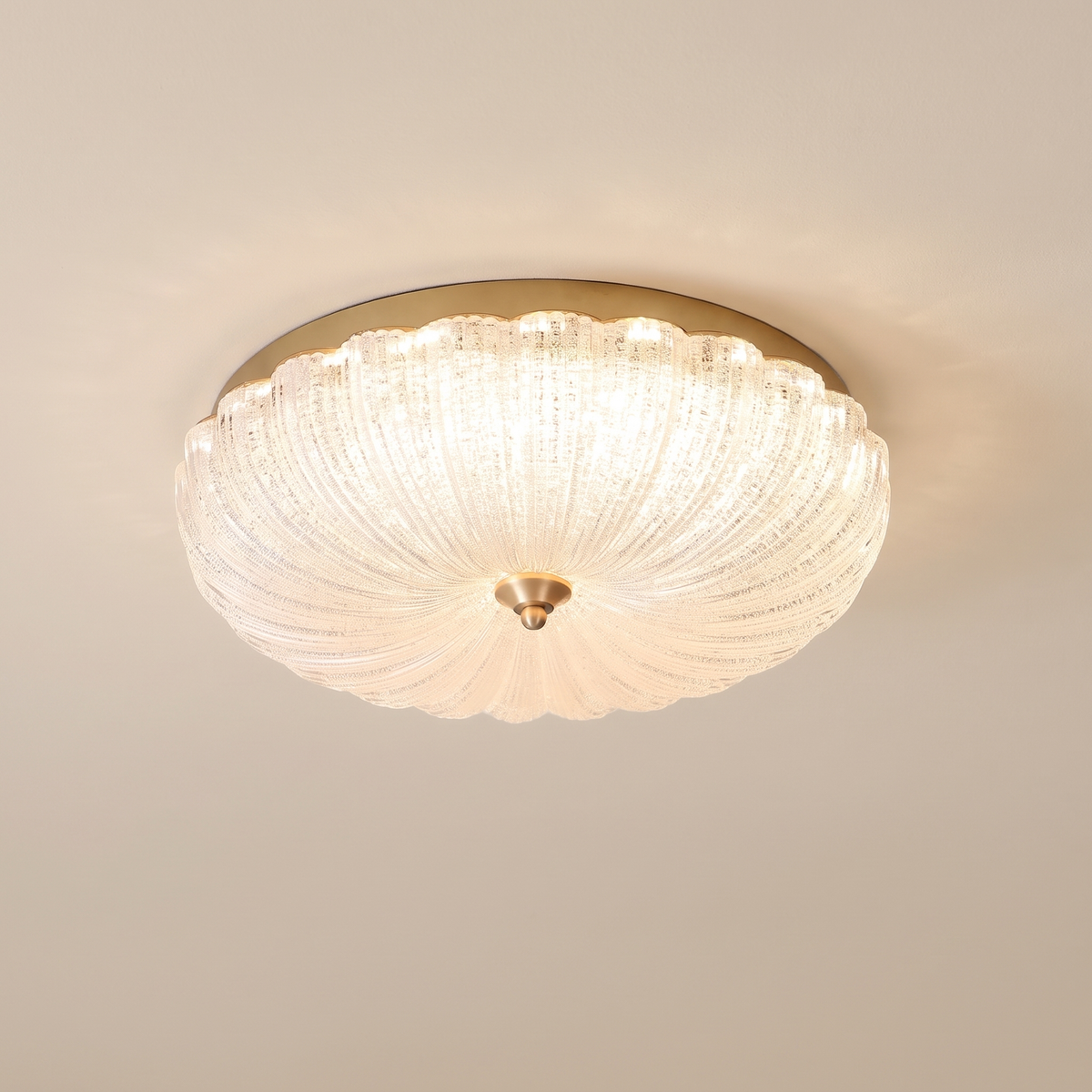 Ruchelle Textured Glass Ceiling Light: flush ceiling light: a round gold base with a scalloped ribbed textured frosted glass dome and a small gold centre finial