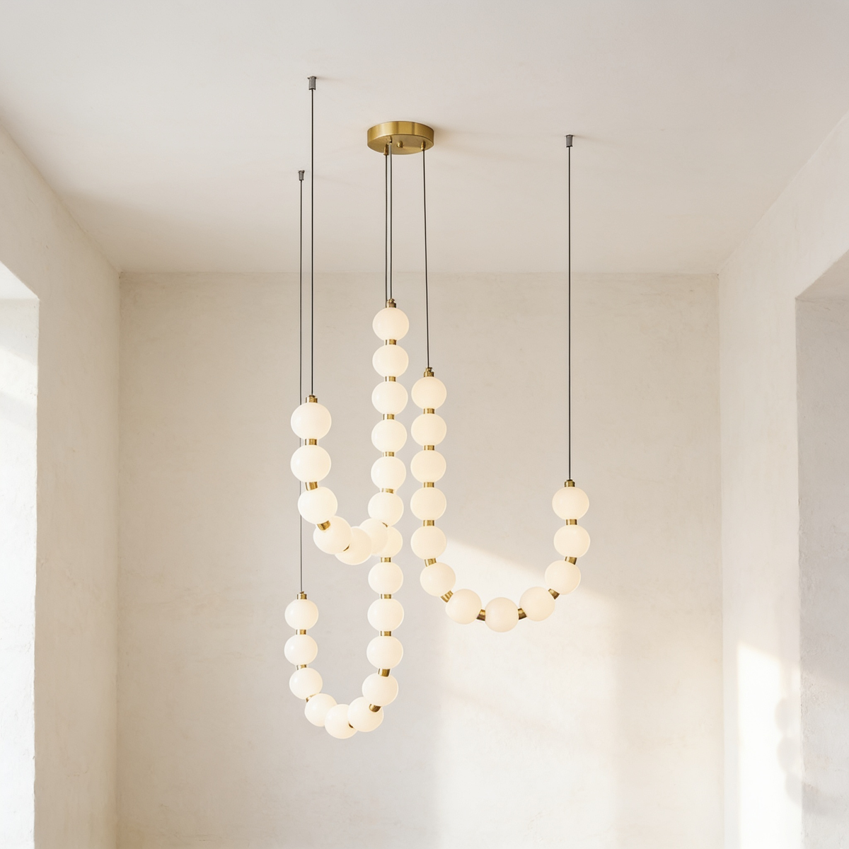 Perloria Chandelier, three strands of opal glass balls with brass collars