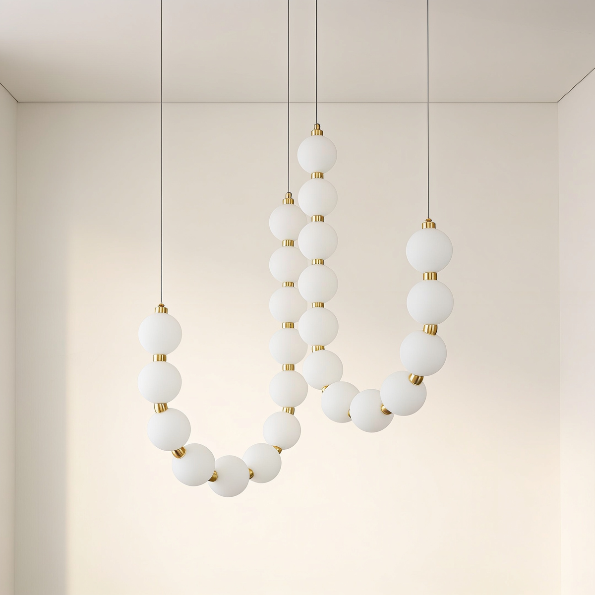 Perloria Chandelier, Double: two looping strands of opal glass globes with brass collars