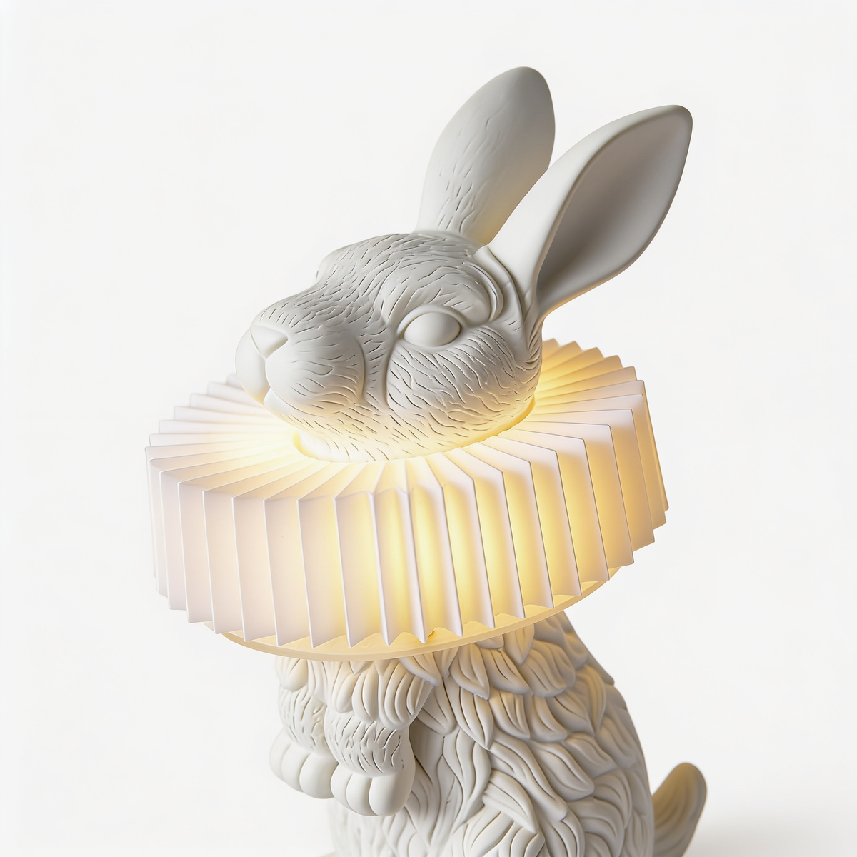Rabellin Table Lamp close-up of the leaf-textured rabbit and lit pleated collar shade