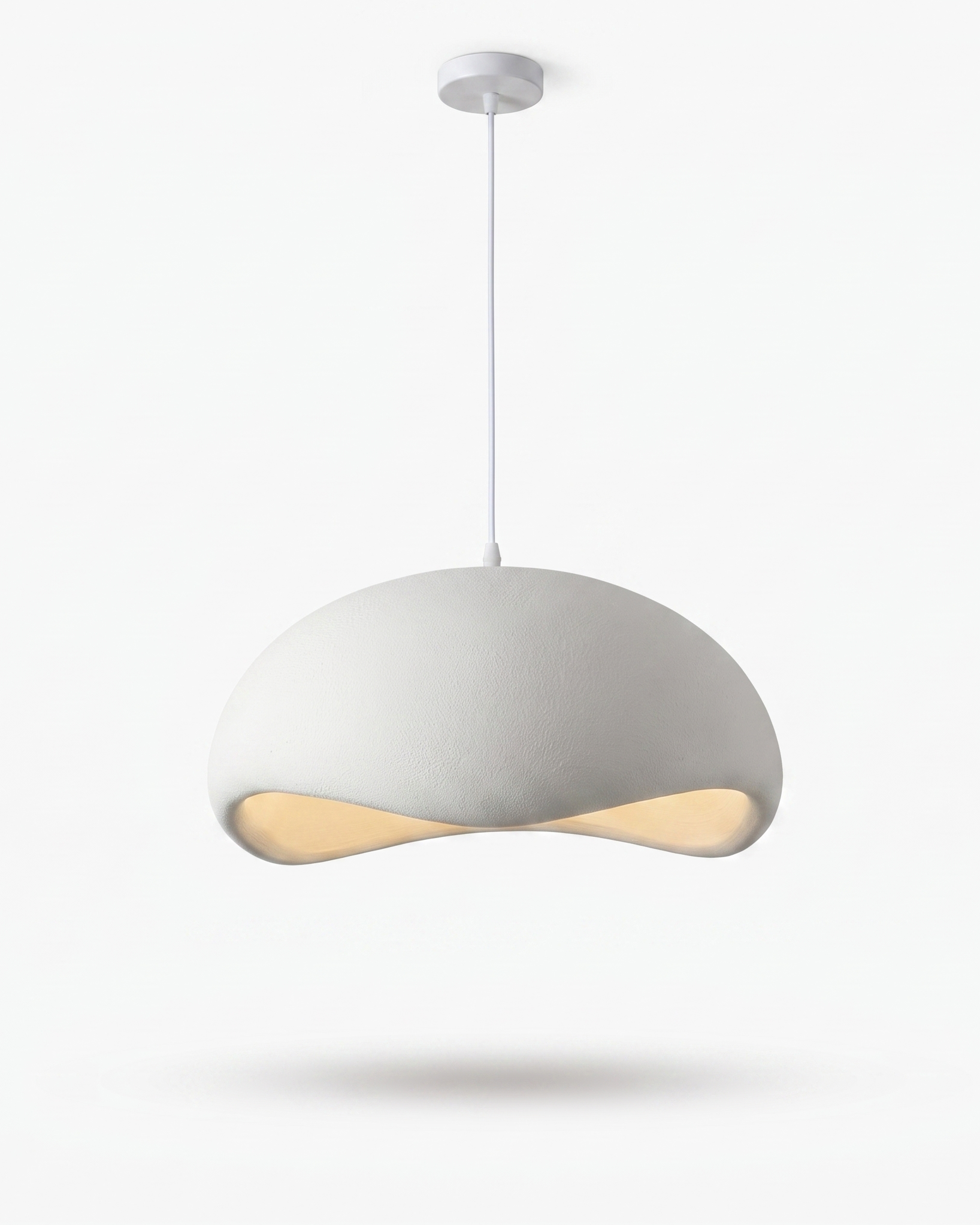 Nuvola cloud pendant glowing warm in an evening interior (accepted 4:5 crop)
