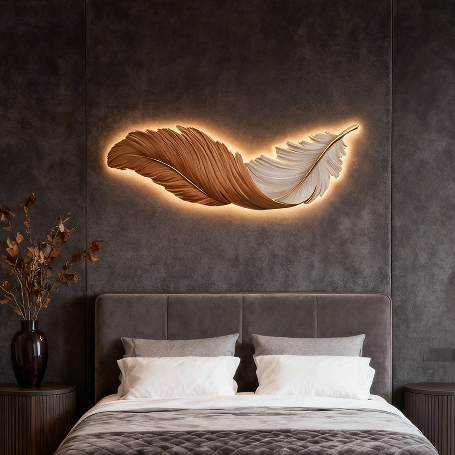 Comvilo Feather Wall Lamp in orange and white, mounted horizontally and lit above a bed